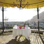 Table with bottles and glasses under a gazebo – wedding reception in a summer day in Pozzuoli near Naples